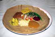 Injera - traditional ethiopian food. It is sour cake with meat or vegetable sauces. Ethiopia.