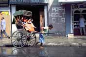 Men pulling rikshaw. Calcutta. India.