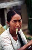 Woman smoking cheroot - traditional Burmese cigar. Inle lake area. Myanmar (Burma).
