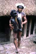 Villager from Dani tribe with 300 years old mummy. Jiwika village. Indonesia.