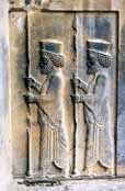 Reliefs at tomb of king Artaxerxes II. Persepolis. Iran.