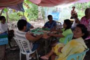 Chinese domino-like game is very popular. Malapascua. Philippines.