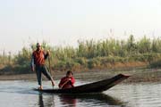 Traditional canoe paddling by leg. Man from Intha tribe. Inle lake. Myanmar (Burma).