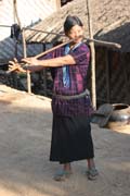 Woman from Dai Chin tribe playing at nose flute, Mindat village, Chin State. Myanmar (Burma).