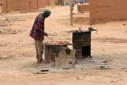 Street snack vendor. He sells roasted meat. Agadez town. Niger.