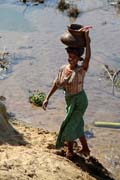 Water transportation into a house. Camp with working elephants. Taungoo town area. Myanmar (Burma).