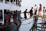 Entrance by narrow plank is not easy. Goverment ferry which is connecting Sittwe and Mrauk U. Myanmar (Burma).