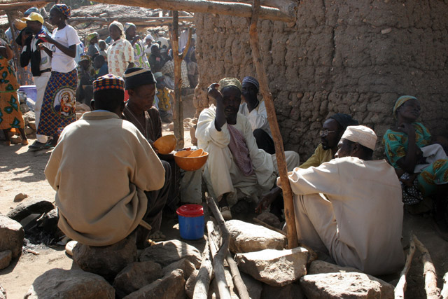 At the market at Rhumsiki (Roumsiki) village at Mandara Mountains. Drinking of local alcohol is very popular during market. Cameroon.
