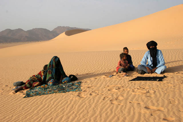 Nomad tuareg famyli which lives near Arrakau sand dunes. Sahara desert. Niger.