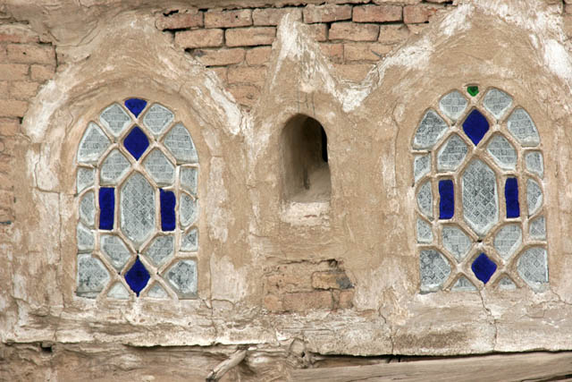 Traditional colorful windows at houses at old quarter of Sana capitol. Original window material was alabaster it is exchanged by colorful glass now. Yemen.