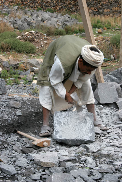 Stonemason at Shibam-Kawkaban village. Yemen.