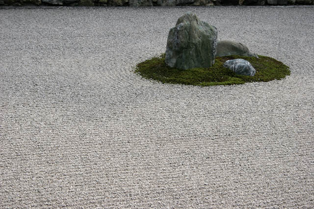 Famous karesansui (dry landscape) rock garden inside Ryoan-ji temple. It has been built in the late 1400s. Kyoto. Japan.