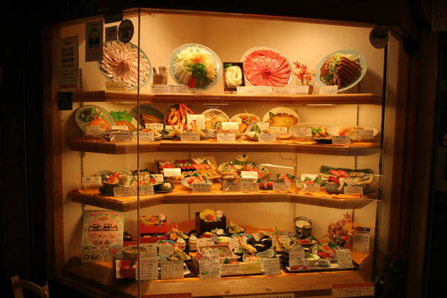 You can see plastic models of all available foods in front of each restaurant. District Dotombori (also called Dotomburi) at Osaka. Japan.