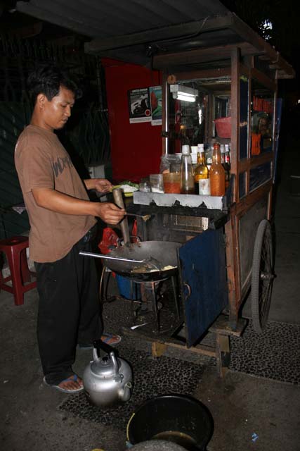 Street stall with fried rice (nasigoreng). Jakarta. Java,  Indonesia.