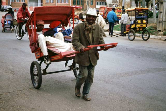 Local transport pousse-pousse, Antsirabe. Madagascar.