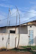 Ouidah town is the centre of the Voodoo cult which is very live here. White flag is symbol that the owner of the house practices Voodoo cult especially "snake" voodoo. Benin.