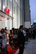 Shopping by japanese style - several hundred meters long queue in front of H&M store. Opening of the first shop of this brand and all are expecting huge discounts. Ginza district, Tokyo. Japan.