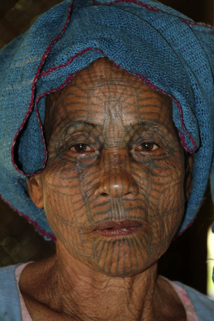 Woman from Chin tribe, Mrauk U area. Women have tradtionaly tattooed their faces. Myanmar (Burma).